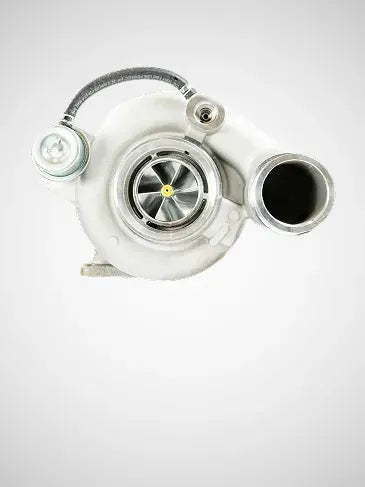 A white automotive turbocharger with a silver metal turbine wheel and a black intake port, shown against a light gray gradient background.