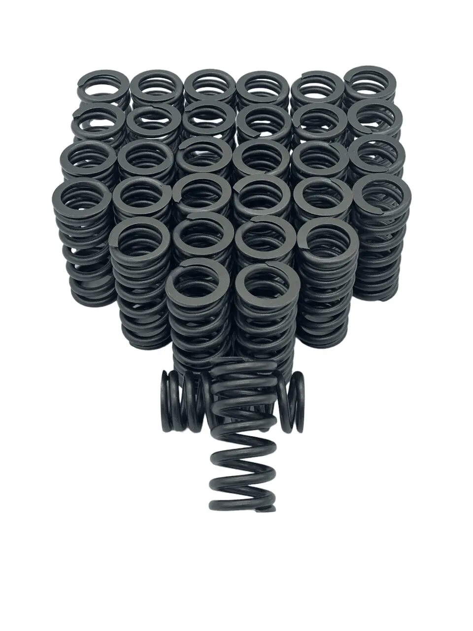 Stack of black metal coil springs.