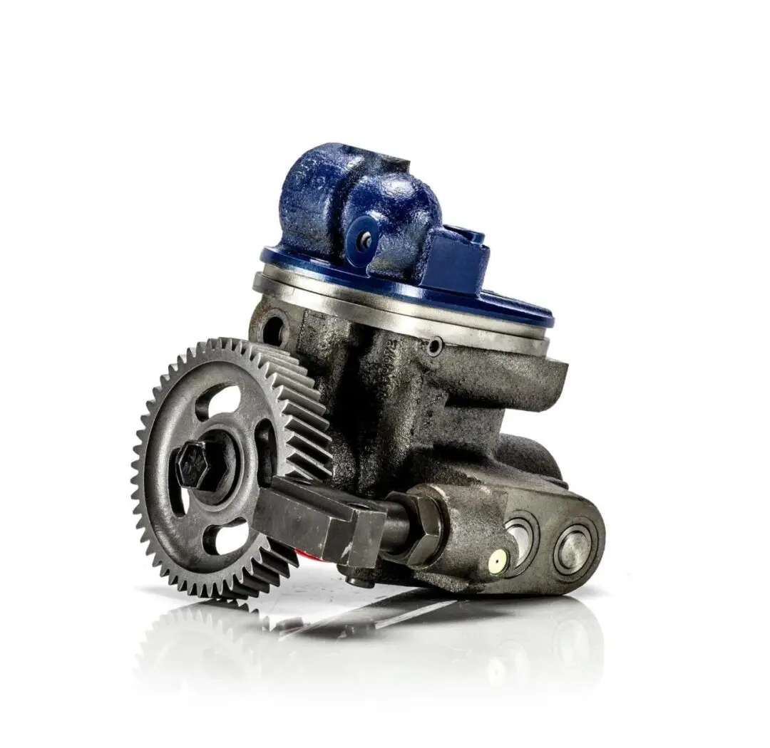 A mechanical turbocharger with gears and a blue compressor housing.