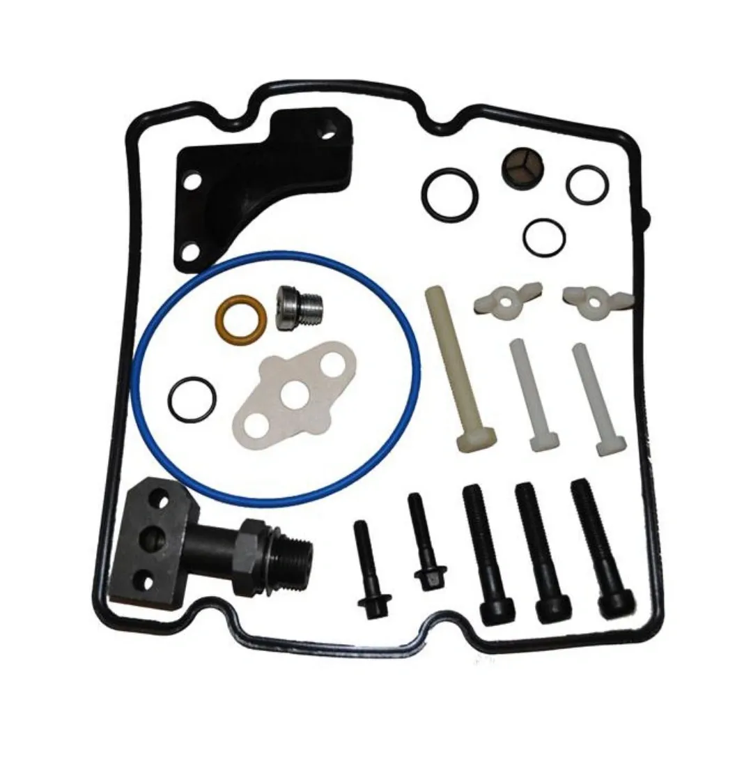 A set of automotive gasket and bolts on a white background.